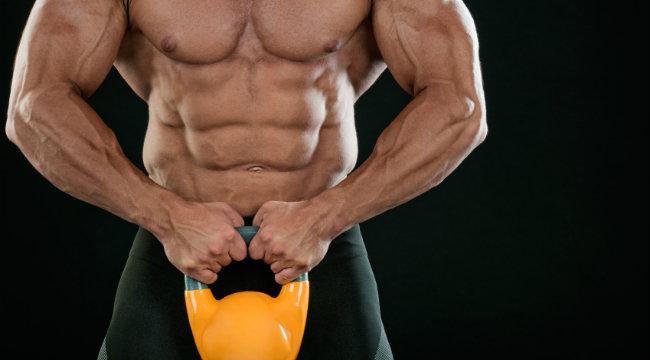 Muscular Man Holding a Kettlebell