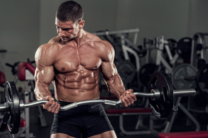 testosterone-booster-test-max Muscular Man Lifting Bent Barbell